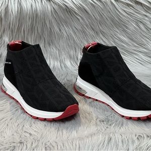 DKNY Women’s Stretch knit fashion sneakers. Slip on with a back zipper